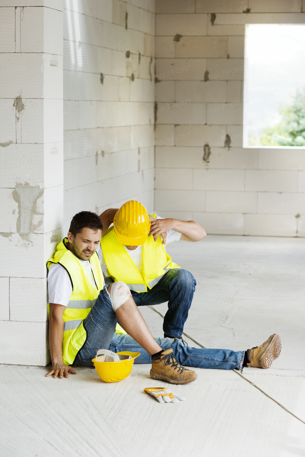 Two builders working on building.