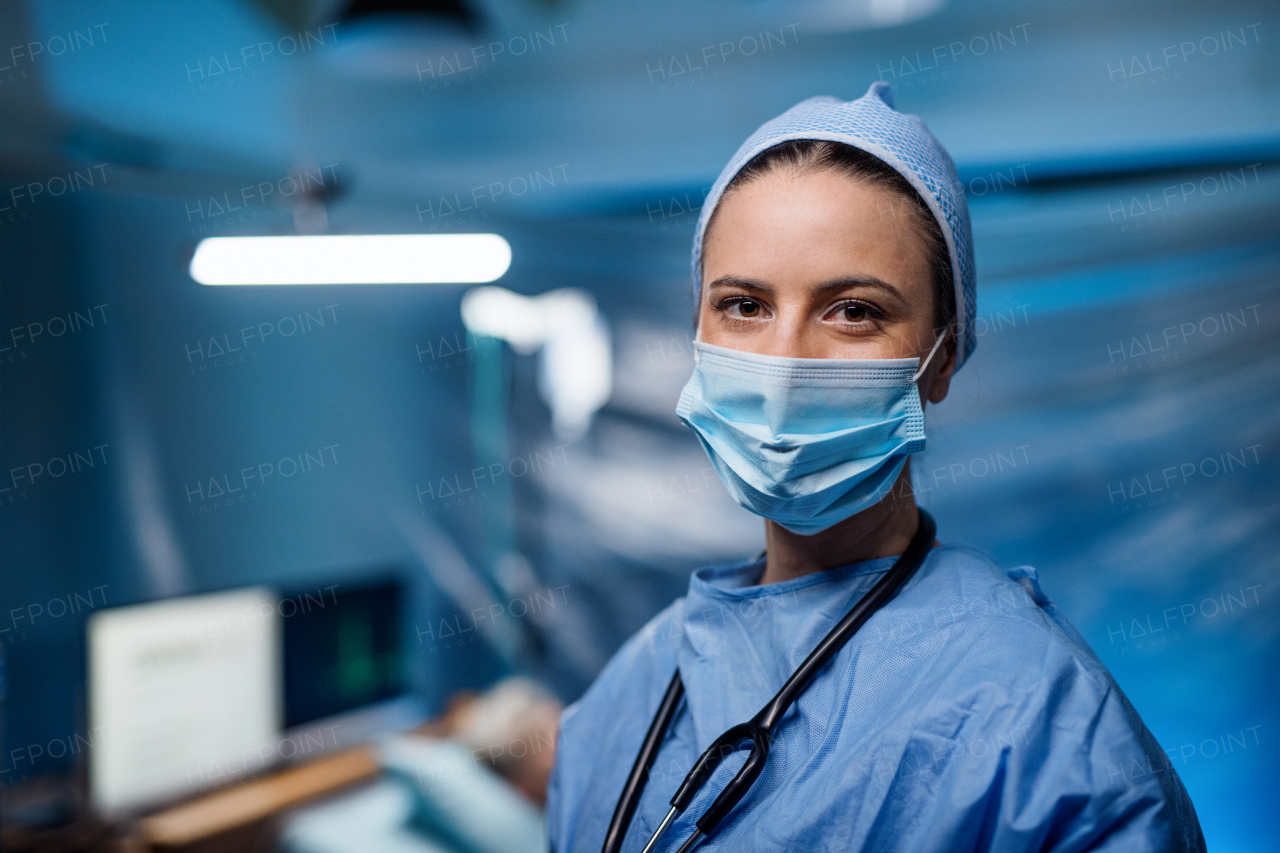 Doctor in hospital looking at camera, coronavirus concept. Copy space.