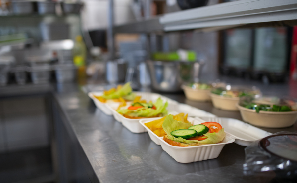 The meals containers prepared for take away in kitchen restaurant.