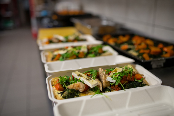 The meals containers prepared for take away in kitchen restaurant.