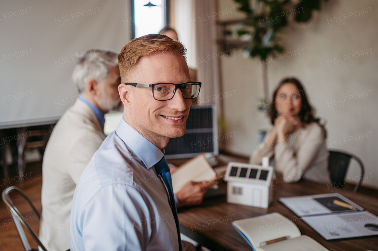 Portrait of young businessman during meeting in the office.