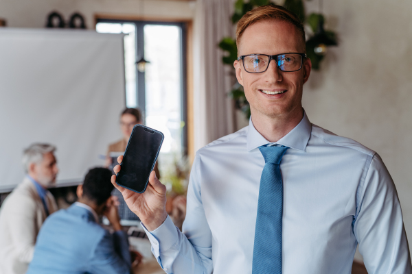 Portrait of young businessman during meeting in the office.