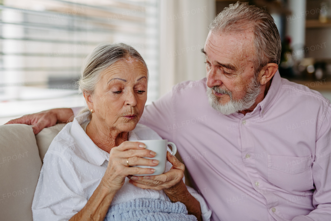 Senior couple enjoying time in their living room.