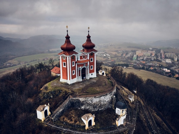 Aerial view of historical church atop on the hill. Late baroque calvary in Banska Stiavnica in Slovakia.