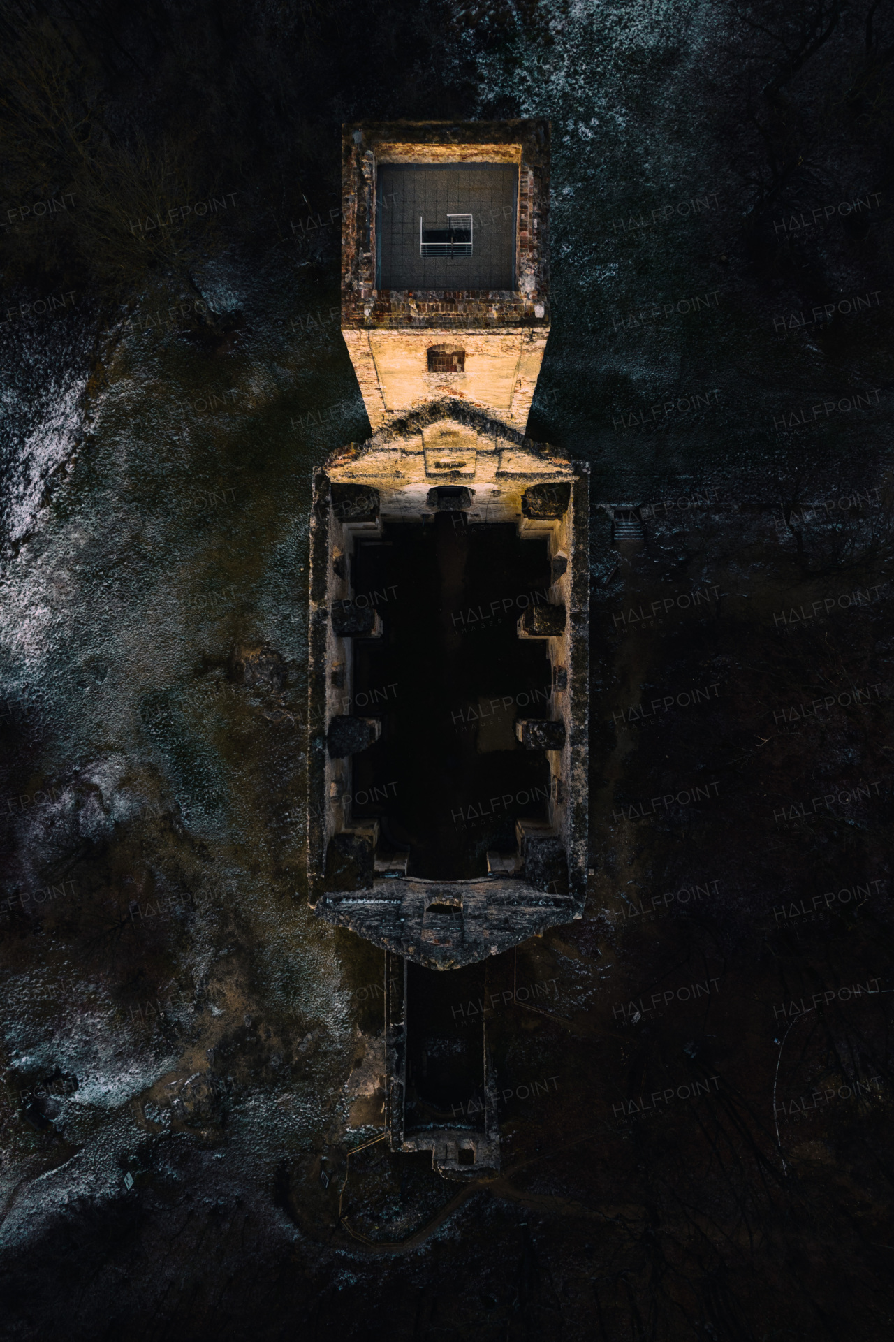Aerial view of an old abandoned building, skyscraper in the city. Top view of old derelict building in a bad state.