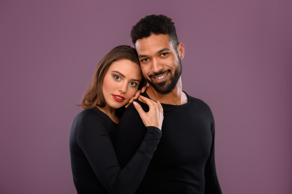 Portrait of a young multiracial couple, studio shoot.