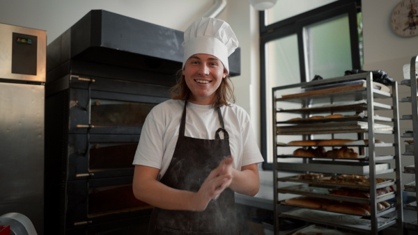Video of young baker preparing pastries in a bakery.