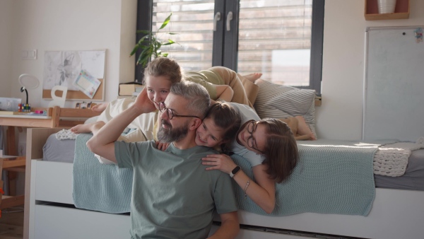 Video of father with three daughters at home. Girl dad concept.