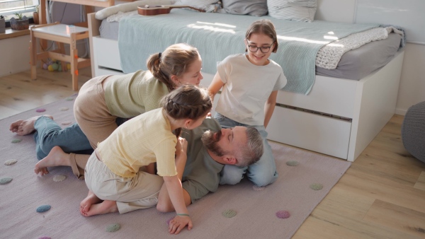 Video of father with three daughters at home. Girl dad concept.