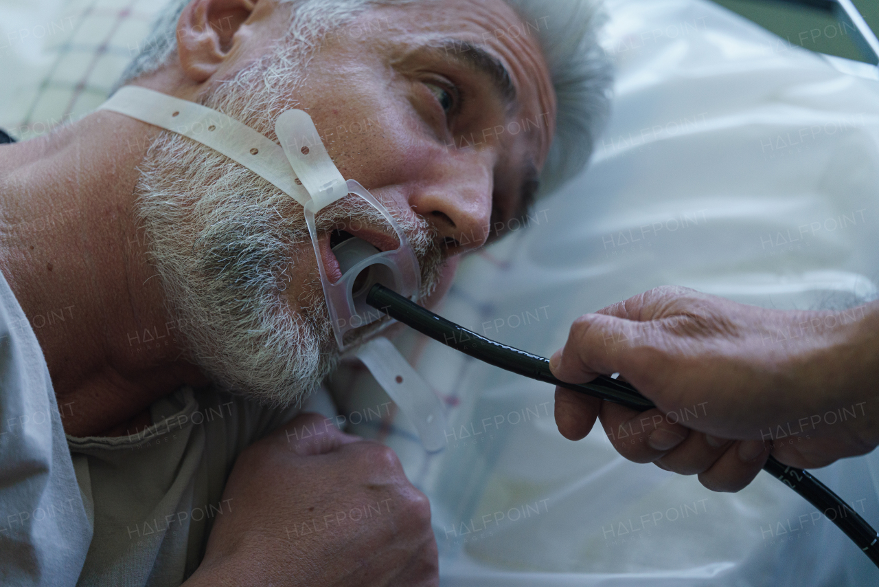 Gastroscopy procedure on sedated patient to examine upper digestive tract. Medical procedure.