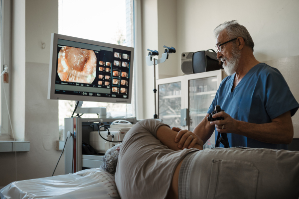 Gastroscopy procedure on sedated patient to examine upper digestive tract. Medical procedure.