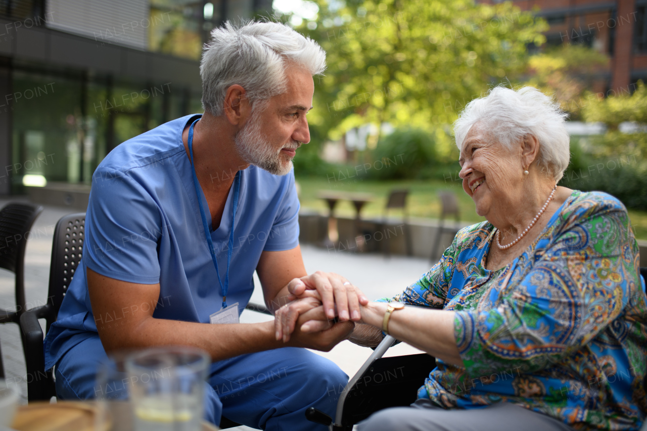 Healthcare worker listening to senior patients problems. Concept of emotional support.