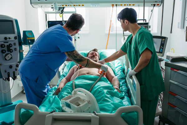Medical team performing CPR and electric shock during cardiac arrest.