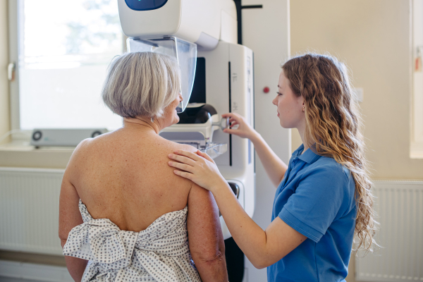 Elderly woman undergoing mammogram during annual preventive checkup