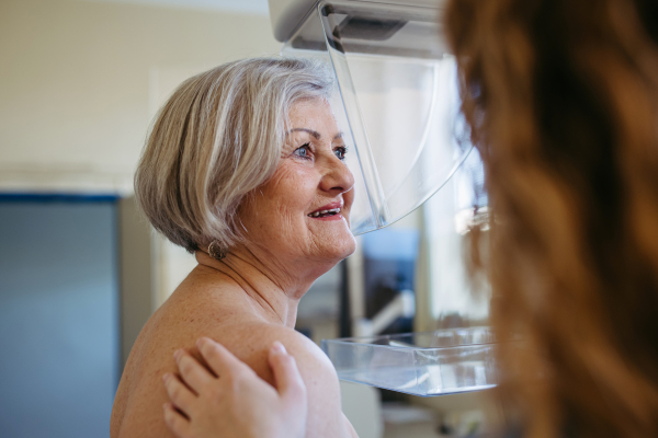 Elderly woman undergoing mammogram during annual preventive checkup