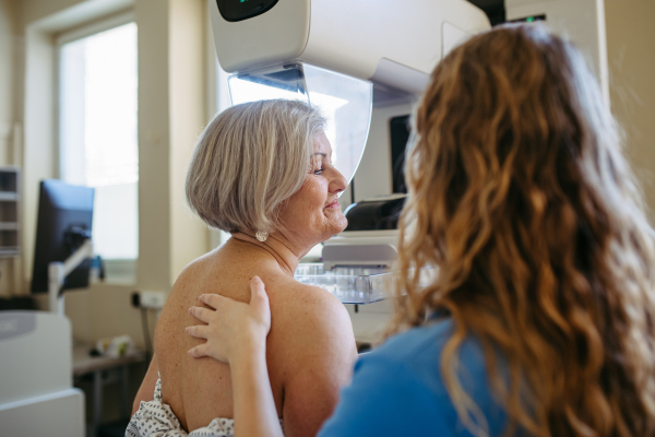 Elderly woman undergoing mammogram during annual preventive checkup