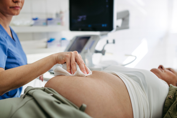 Ultrasound exam for older female patient during health check