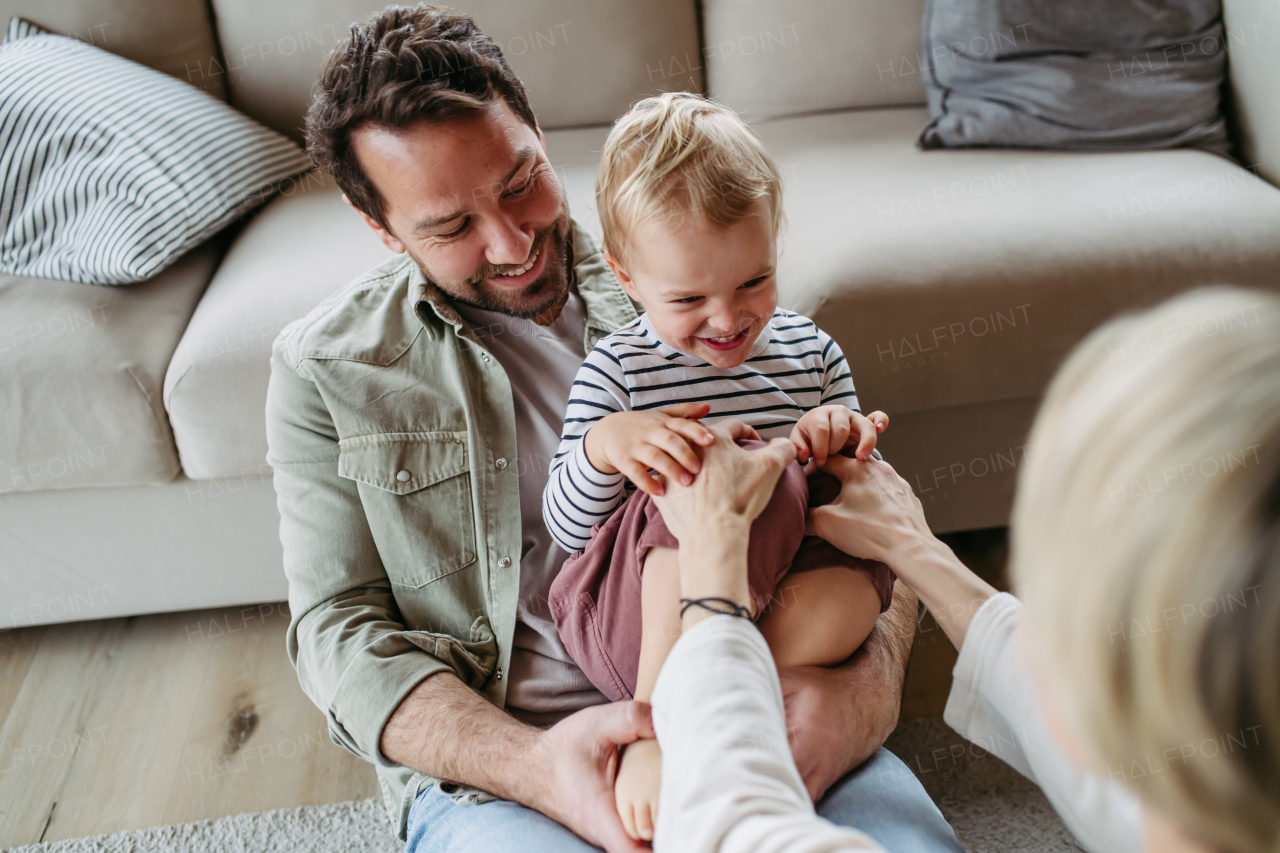 Happy family playing together at home. Bonding moment.