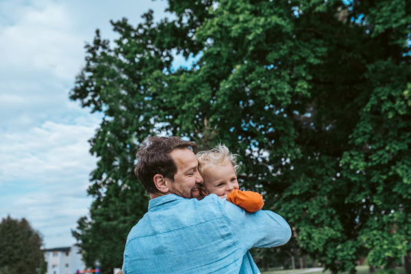 Portrait of dad and child enjoying time together. Fathers day concept.