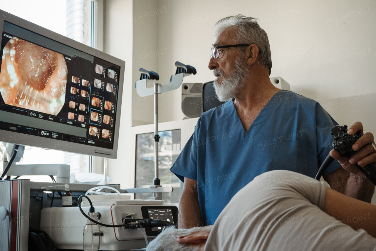 Gastroscopy procedure on sedated patient to examine upper digestive tract. Medical procedure.