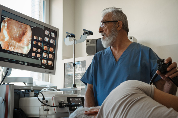 Gastroscopy procedure on sedated patient to examine upper digestive tract. Medical procedure.