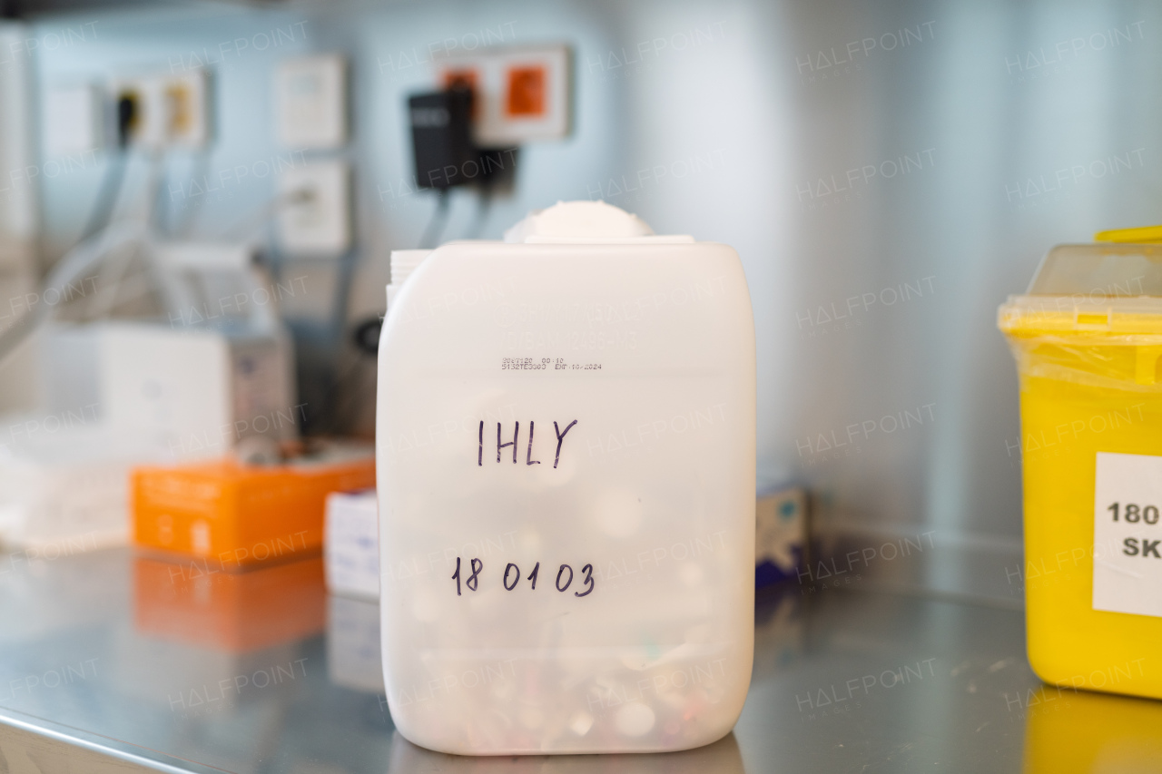 Disposal of injection needle in marked container in clinic