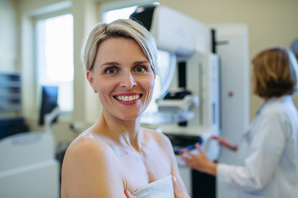 Portrait of female patient before breast cancer screening. Mammography procedure.