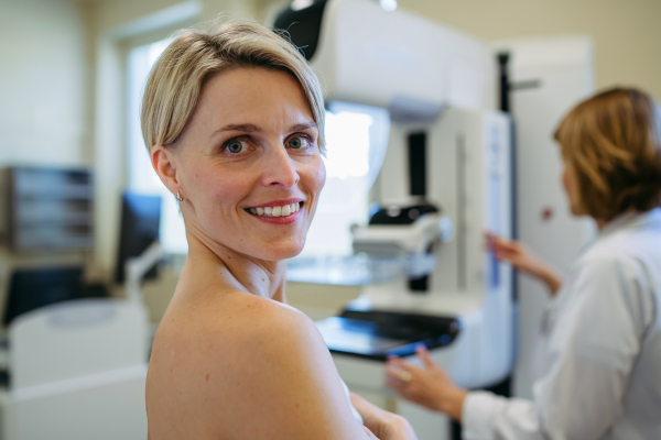 Portrait of female patient before breast cancer screening. Mammography procedure.