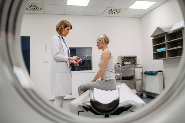 Medical professional delivering difficult news after diagnostic scan. Medical consultation.
