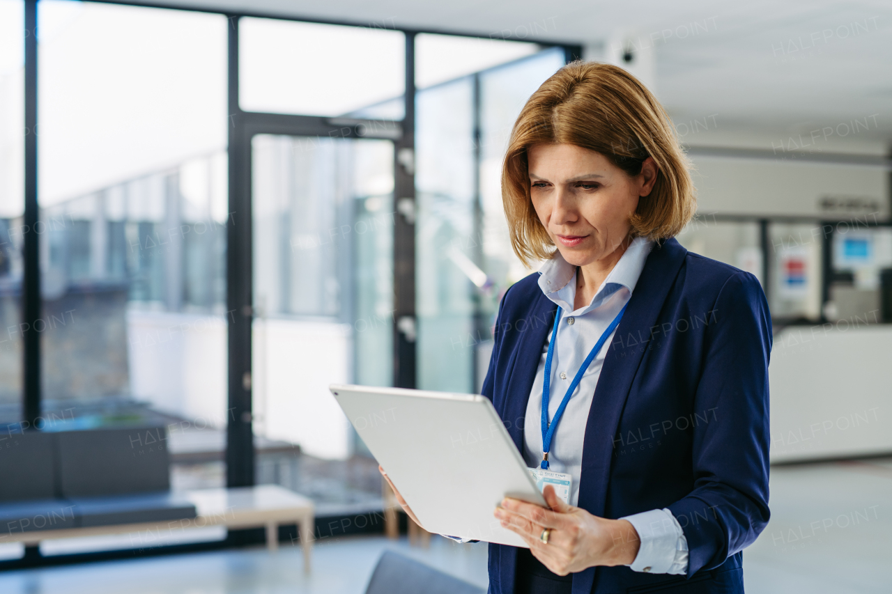 Portrait of female medical sales representative, medical clinic setting.