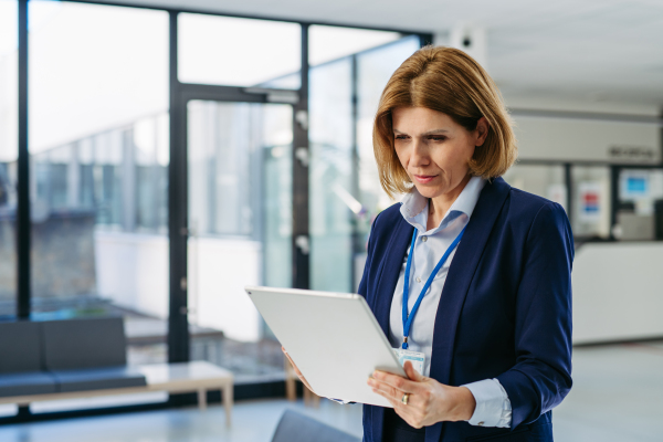 Portrait of female medical sales representative, medical clinic setting.