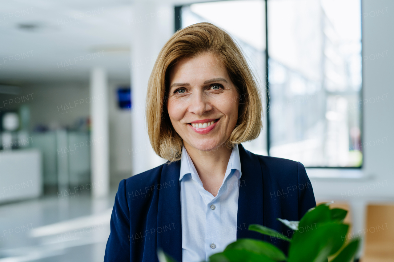 Portrait of female medical sales representative, medical clinic setting.