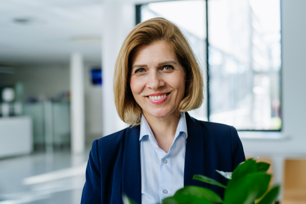 Portrait of female medical sales representative, medical clinic setting.