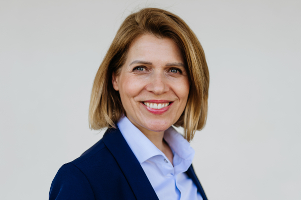Portrait of female medical sales representative, medical clinic setting.