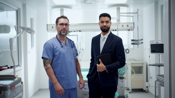 A pharmaceutical sales respresentative with doctor in hospital.