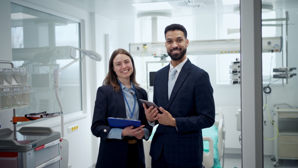 Hospital management. Hospital director and manager in modern clinic.