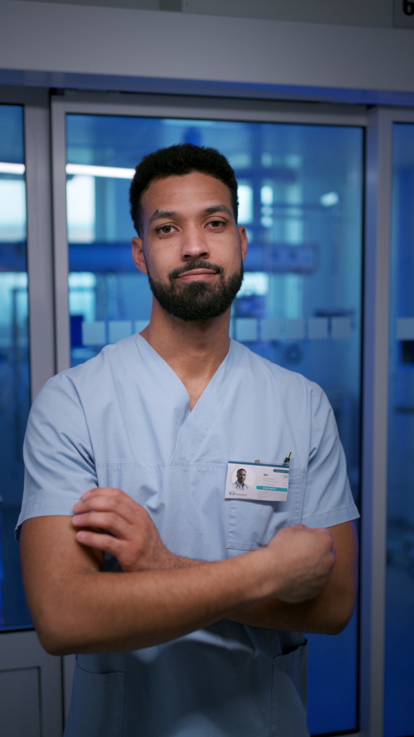 A smiling young nurse doctor in hospital.