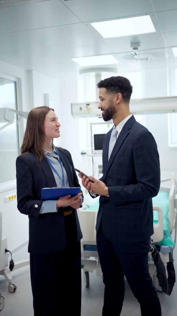 Hospital management. Hospital director and manager in modern clinic.