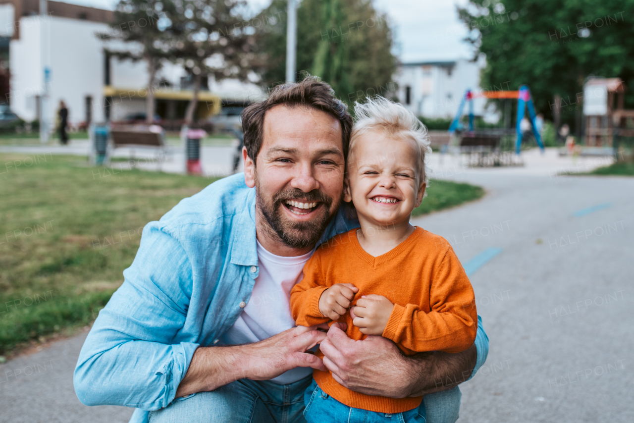 Portrait of dad and child enjoying time together. Fathers day concept.