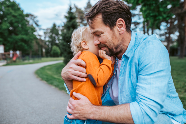 Portrait of dad and child enjoying time together. Fathers day concept.