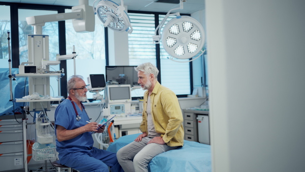 Patient sitting on examination table, describing health problems.