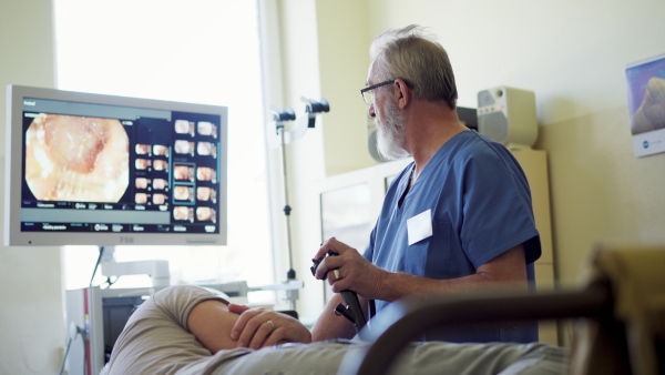 Gastroscopy procedure on sedated patient to examine upper digestive tract. Medical procedure.