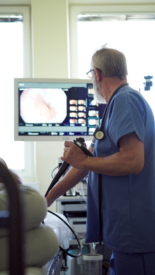 Gastroscopy procedure on sedated patient to examine upper digestive tract. Medical procedure.