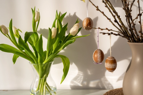Easter decoration, painted easter eggs on pussy willow branches.
