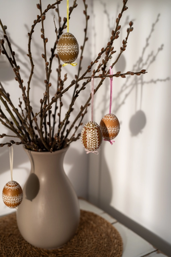Easter decoration, painted easter eggs on pussy willow branches.